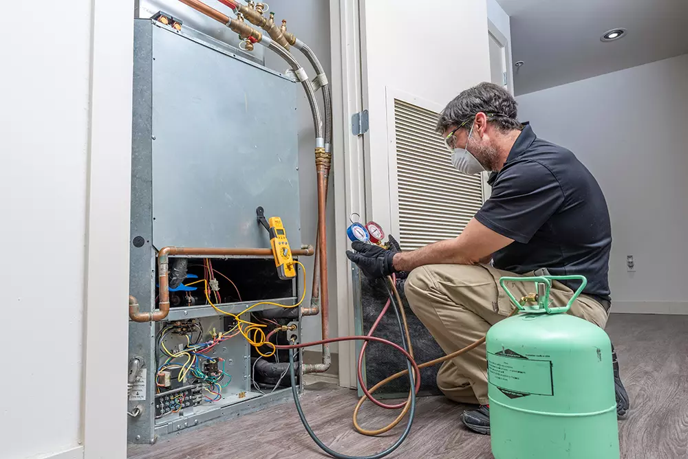 man fixing hvac